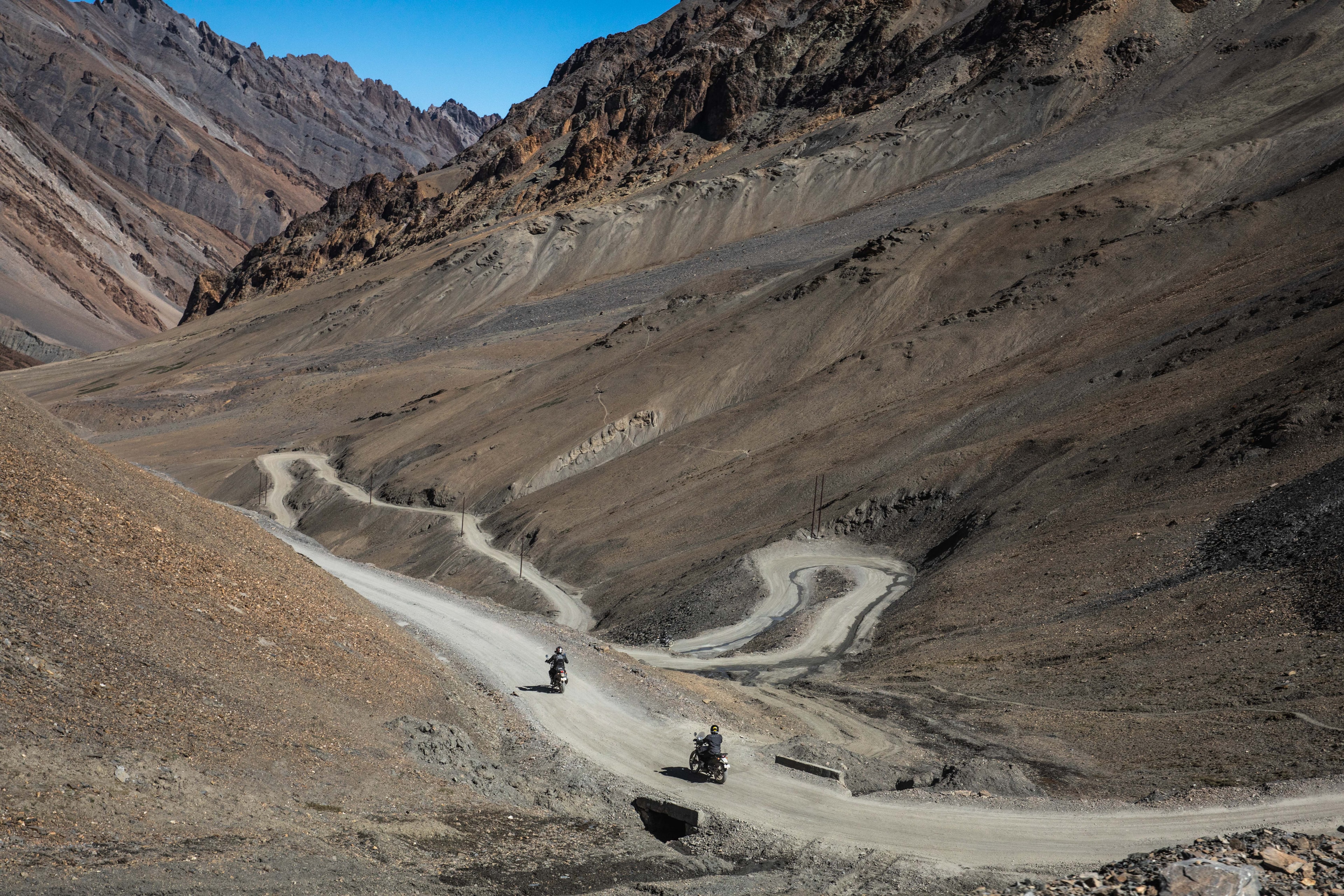 Motorcycle rider on Himalayan mountain pass
